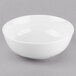 A Libbey Porcelana white porcelain noodle soup bowl on a gray surface.