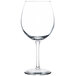 A close-up of a clear Libbey Vina Balloon Wine Glass with a stem.