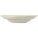 A close-up of a Libbey Porcelana cream white porcelain pasta bowl with a wide rim and rolled edge.