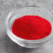 A bowl of Chefmaster red dry powder food color.