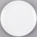 A Libbey Porcelana white porcelain coupe plate on a gray surface.