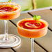 Two glasses of Andros Chef blood orange drinks garnished with orange slices.