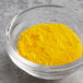 A bowl of Chefmaster Yellow Dry Powder Food Color.