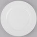 A Libbey Porcelana white porcelain plate with a wide white rim.