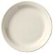 A close-up of a Libbey Porcelana Cream white plate with a plain edge.