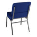 A Lancaster Table & Seating church chair with navy fabric and metal legs.