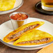 A white plate with two Caribbean Food Delights Baked Spicy Beef Patties.