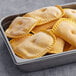 A tray of unbaked Caribbean Food Delights Beefy Cheese Patties.