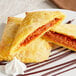 A white plate of unbaked Caribbean Food Delights Plantain Tarts.