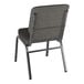 A Lancaster Table & Seating silver vein church chair with gray fabric and metal legs.