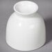 A white rectangular Whittier porcelain sake cup on a gray surface.