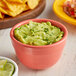 A bowl of Wholly Guacamole and chips.