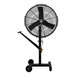 A Big Ass Fans black pedestal fan on wheels.