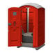 A red J & J Echo One portable restroom open with a white lid.