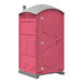 A pink portable restroom with a grey door.