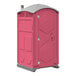 A pink portable toilet with a grey door.