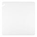 A white square cutting board with a hole in the middle.