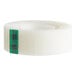 A roll of 3M transparent tape with a green and black plaid label.