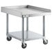 A stainless steel Regency equipment stand with wheels.