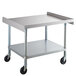 A Regency stainless steel equipment stand with casters.