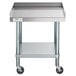 A Regency stainless steel equipment stand with wheels and a shelf.