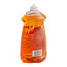 A plastic bottle of orange liquid dish detergent.