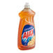 A plastic bottle of Ajax Triple Action Orange Scent dish detergent on a counter.