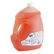 A white jug of Ajax Ultra orange scented liquid dish detergent with a white label.