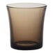 A brown Duralex glass on a white background.
