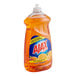 A bottle of Ajax Triple Action Orange Scent dishwashing liquid on a counter.