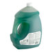 A green liquid in a Palmolive jug with a white cap and label.