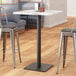 A table with a black pole from Lancaster Table and Seating.