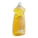 A close up of a yellow plastic bottle of Ajax Ultra Lemon Scent dish detergent.