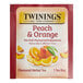 A red and white Twinings box of peach and orange herbal tea bags.