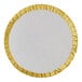A round white plate with gold trim.
