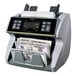 A Kolibri mixed denomination bill counting machine with two bills being counted.