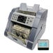 A Cassida 8800R bill counting machine with a digital display.