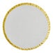 A round white plate with gold trim.