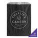 A customizable black paper bag with white text that says "Charlie's Bakery"