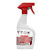 A close-up of a white and red Hoover Oxy Spot and Stain Remover spray bottle.