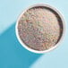 A bowl of Adourne Pastel Rainbow Sanding Sugar.