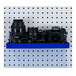 A blue shelf holding cameras and lenses.