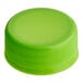 A lime green plastic cap for juice bottles.