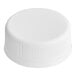 A white plastic cap for juice bottles.