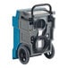 A blue and grey Boltic commercial dehumidifier with black wheels.