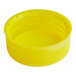 A close-up of a yellow unlined tamper-evident cap for an HPP juice bottle.