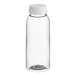 A clear plastic juice bottle with a white lid.