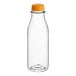 A clear plastic carafe juice bottle with an orange lid.