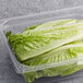 A plastic container with Romaine hearts inside.