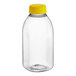 A clear plastic 12 oz. square rPET juice bottle with a yellow lid.